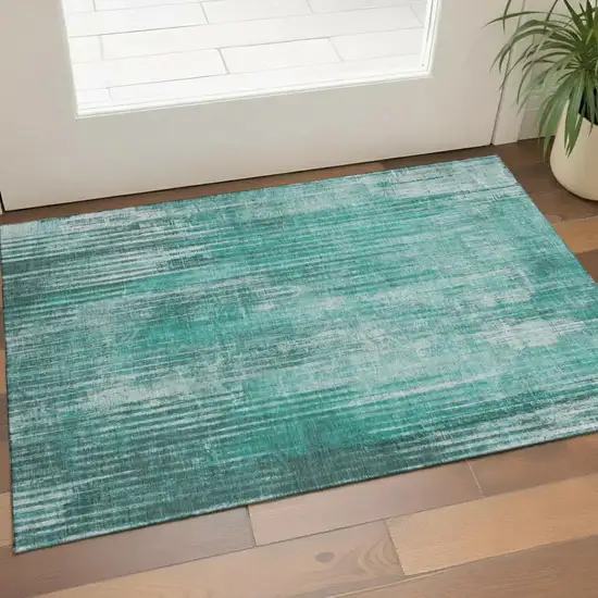 Teal And Ivory Striped Washable Area Rug With UV Protection Photo 1