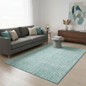 Photo of Teal And Ivory Striped Washable Area Rug With UV Protection