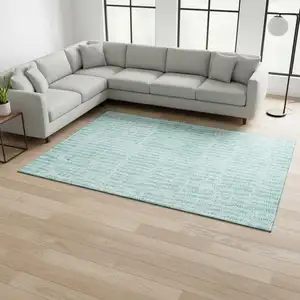 Photo of Teal And Ivory Striped Washable Area Rug With UV Protection