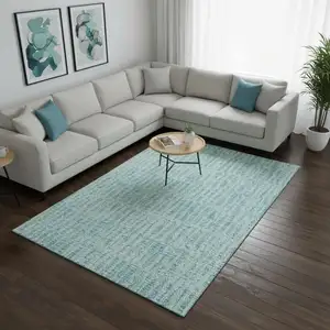 Photo of Teal And Ivory Striped Washable Area Rug With UV Protection