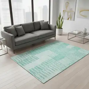 Photo of Teal And Ivory Striped Washable Area Rug With UV Protection