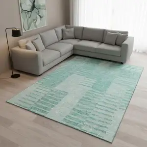 Photo of Teal And Ivory Striped Washable Area Rug With UV Protection