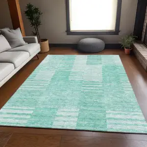 Photo of Teal And Ivory Striped Washable Area Rug With UV Protection