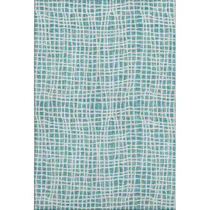 Photo of Teal And Ivory Striped Washable Area Rug With UV Protection