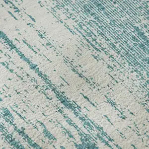 Photo of Teal And Ivory Striped Washable Area Rug With UV Protection
