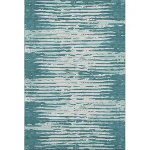 Photo of Teal And Ivory Striped Washable Area Rug With UV Protection