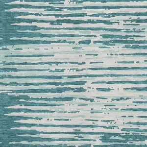 Photo of Teal And Ivory Striped Washable Area Rug With UV Protection