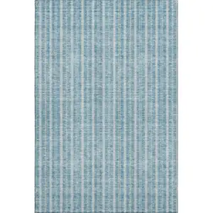 Photo of Teal And Ivory Striped Washable Area Rug With UV Protection