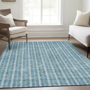 Photo of Teal And Ivory Striped Washable Area Rug With UV Protection
