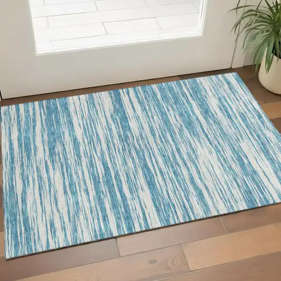 Teal And Ivory Striped Washable Area Rug With UV Protection Photo 1