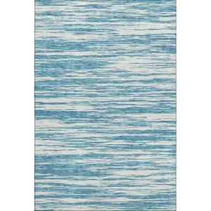 Photo of Teal And Ivory Striped Washable Area Rug With UV Protection