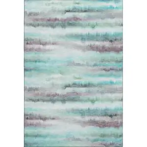 Photo of Teal And Ivory Striped Washable Area Rug With UV Protection
