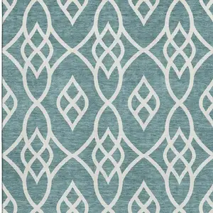 Photo of Teal And Ivory Trellis Washable Area Rug With UV Protection