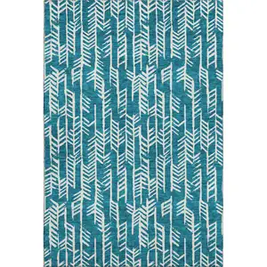 Photo of Teal And Ivory Tribal Washable Area Rug With UV Protection
