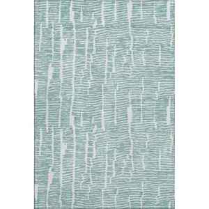 Photo of Teal And Ivory Vermicular Washable Area Rug With UV Protection
