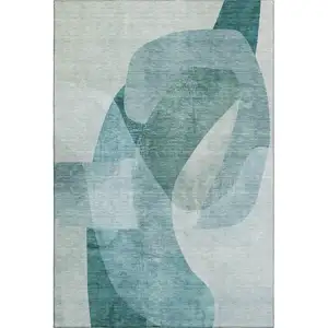 Photo of Teal And Pale Aqua Abstract Washable Area Rug With UV Protection