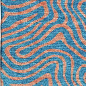 Photo of Teal And Peach Abstract Washable Area Rug With UV Protection