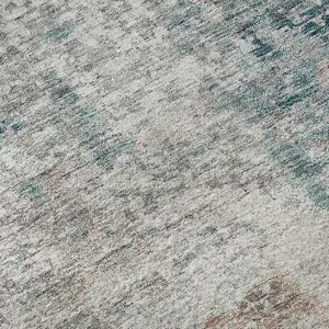 Photo of Teal Beige And Copper Abstract Washable Area Rug With UV Protection