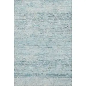 Photo of Teal Beige And Ivory Abstract Geometric Washable Area Rug With UV Protection