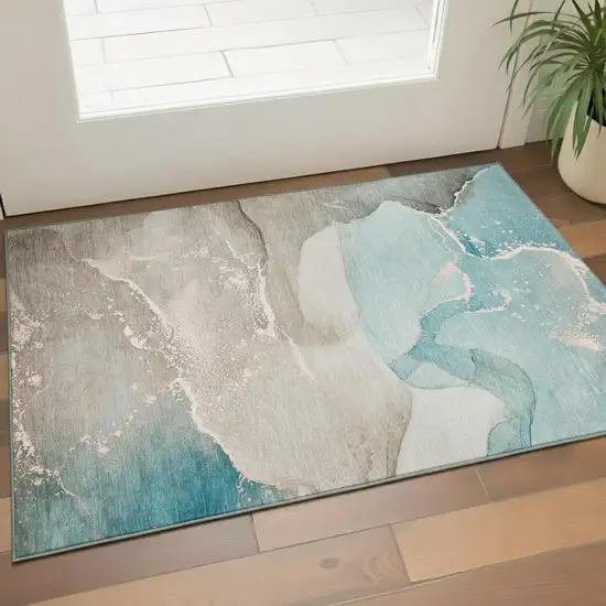 Teal Beige And Ivory Abstract Washable Area Rug With UV Protection Photo 1