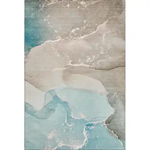 Photo of Teal Beige And Ivory Abstract Washable Area Rug With UV Protection