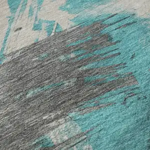 Photo of Teal Beige And Ivory Abstract Washable Area Rug With UV Protection