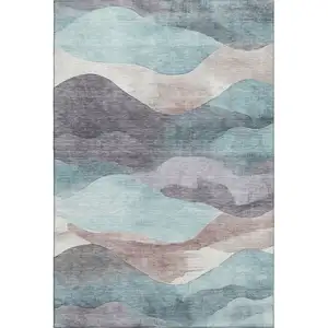 Photo of Teal Beige And Ivory Abstract Washable Area Rug With UV Protection