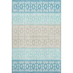 Photo of Teal Beige And Ivory Geometric Washable Area Rug With UV Protection