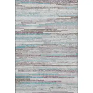 Photo of Teal Beige And Ivory Striped Washable Area Rug With UV Protection