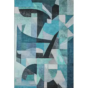 Photo of Teal Black And Blue Abstract Washable Area Rug With UV Protection