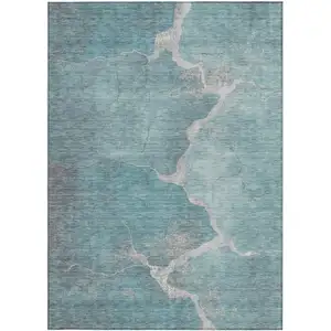 Photo of Teal Blue And Beige Abstract Washable Indoor Outdoor Area Rug