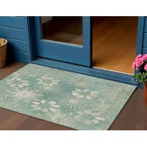 Photo of Teal Blue And Beige Floral Washable Indoor Outdoor Area Rug
