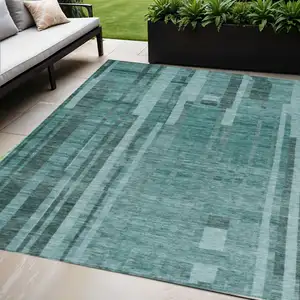 Photo of Teal Blue And Black Striped Washable Indoor Outdoor Area Rug