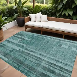 Photo of Teal Blue And Black Striped Washable Indoor Outdoor Area Rug