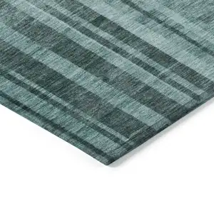 Photo of Teal Blue And Black Striped Washable Indoor Outdoor Area Rug