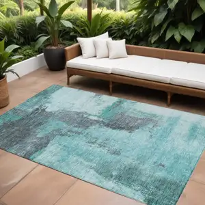 Photo of Teal Blue And Charcoal Abstract Washable Indoor Outdoor Area Rug