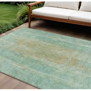 Photo of Teal Blue And Copper Abstract Washable Indoor Outdoor Area Rug