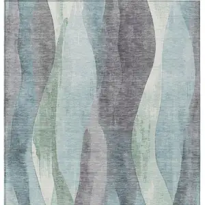 Photo of Teal Blue And Fern Green Abstract Washable Indoor Outdoor Area Rug