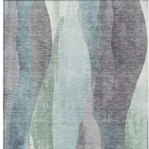 Photo of Teal Blue And Fern Green Abstract Washable Indoor Outdoor Area Rug