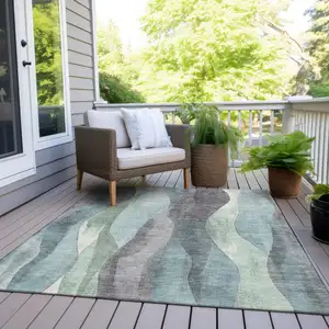 Photo of Teal Blue And Fern Green Abstract Washable Indoor Outdoor Area Rug
