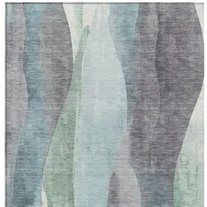 Photo of Teal Blue And Fern Green Abstract Washable Indoor Outdoor Area Rug