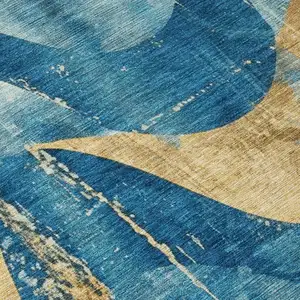 Photo of Teal Blue And Gold Abstract Washable Indoor Outdoor Area Rug
