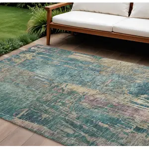 Photo of Teal Blue And Gold Abstract Washable Indoor Outdoor Area Rug