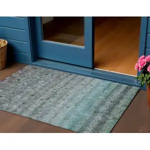 Photo of Teal Blue And Gray Striped Washable Indoor Outdoor Area Rug