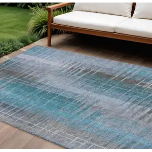 Photo of Teal Blue And Gray Striped Washable Indoor Outdoor Area Rug