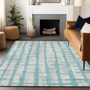 Photo of Teal Blue And Gray Striped Washable Indoor Outdoor Area Rug