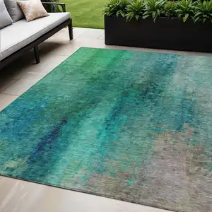Photo of Teal Blue And Green Abstract Washable Indoor Outdoor Area Rug