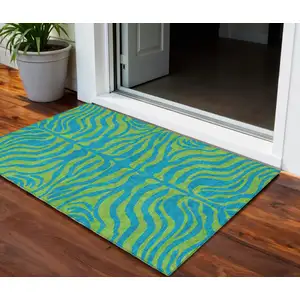 Photo of Teal Blue And Green Animal Print Washable Indoor Outdoor Area Rug