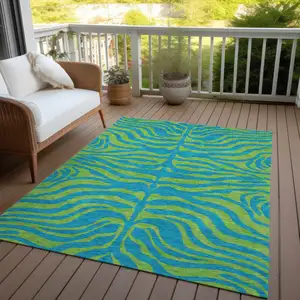 Photo of Teal Blue And Green Animal Print Washable Indoor Outdoor Area Rug