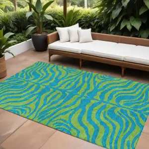 Photo of Teal Blue And Green Animal Print Washable Indoor Outdoor Area Rug